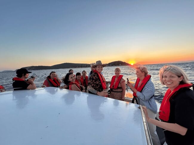 ASC tour guests on a sunset boat ride.