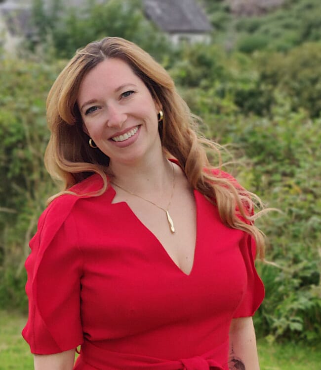 Headshot of a woman in a garden.