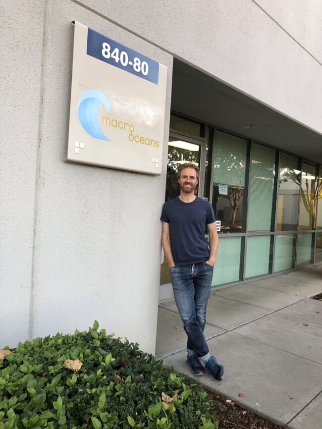 a man standing outside an office