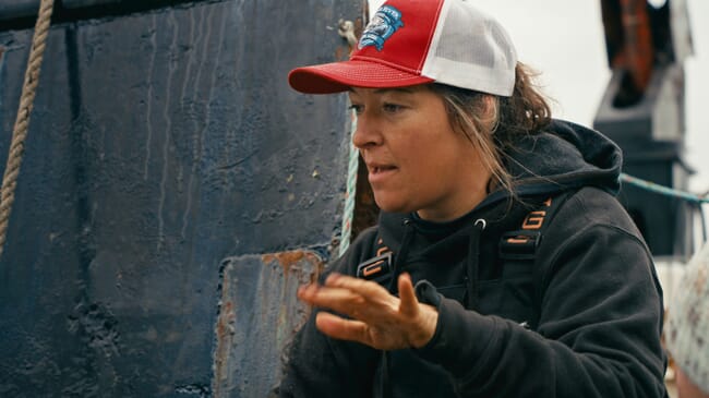 A woman wearing a baseball cap.