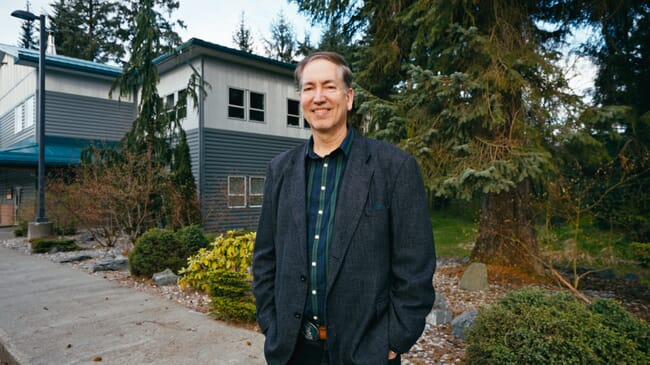 A man standing in a garden.