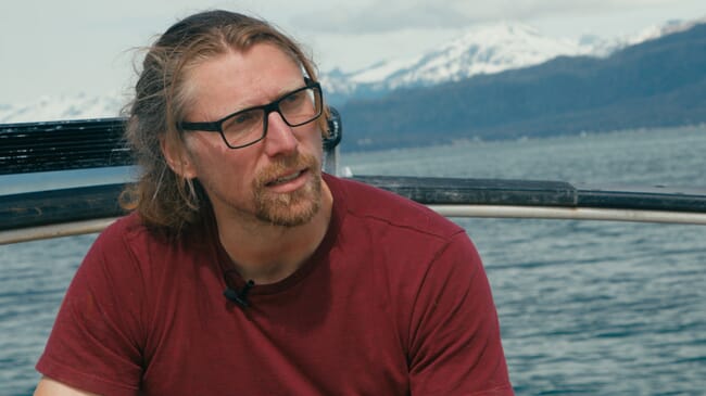 A man sitting on a boat.