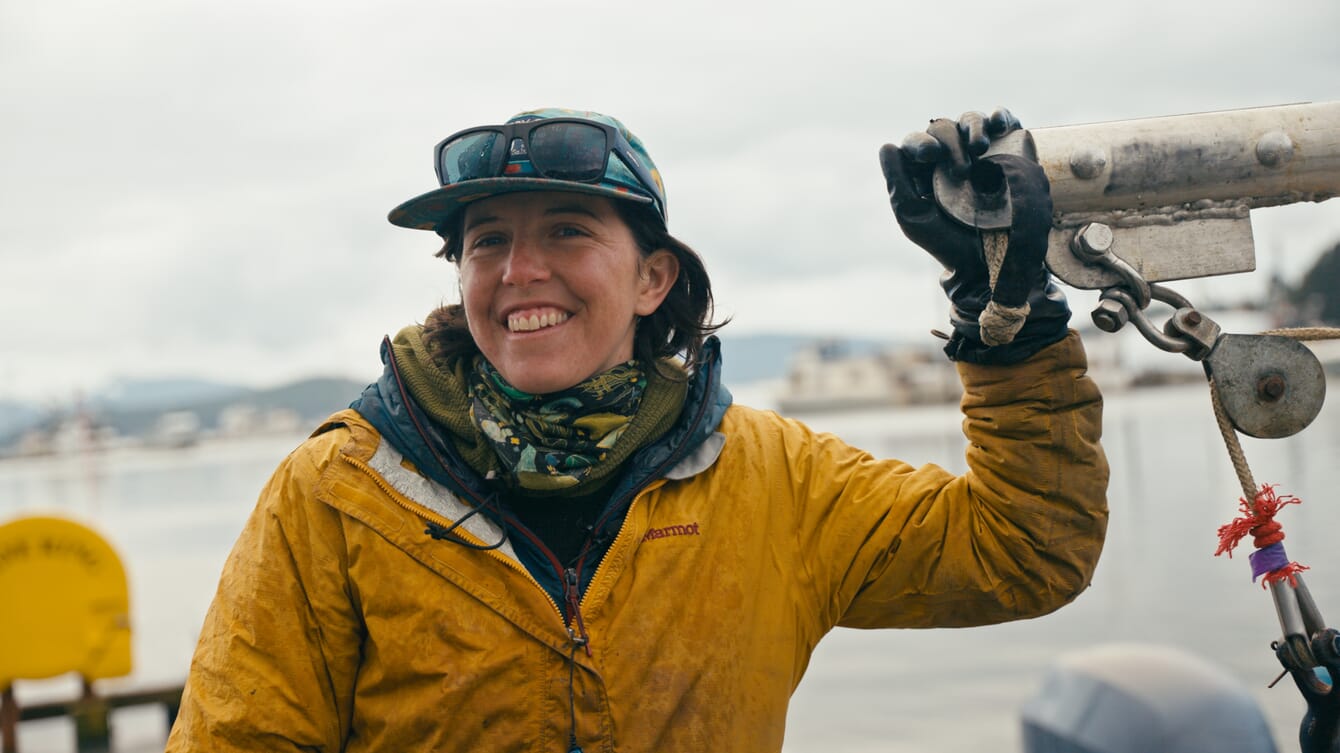 A woman holding a winch.