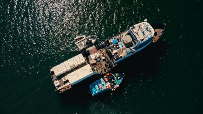 Aerial view of a large vessel with a full deck.