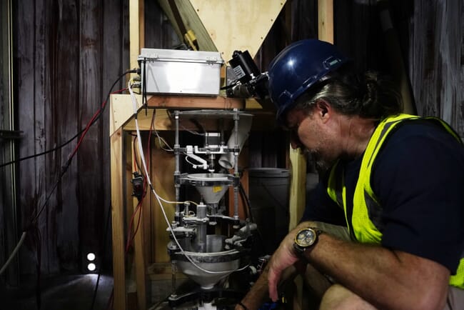 A man inspecting carbon capture technology.