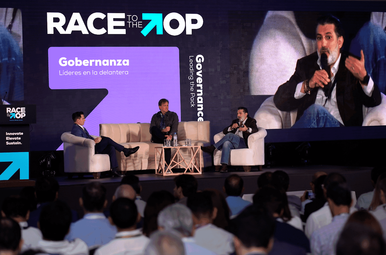 Three men talking about shrimp at an aquaculture conference in Ecuador.