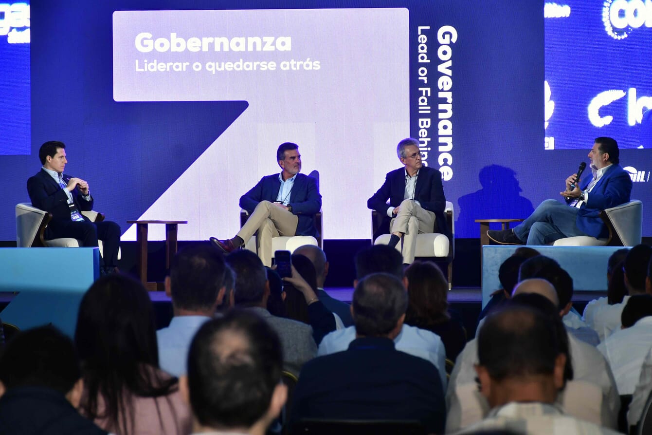 A group of shrimp industry leaders discussing sustainability at a forum in Ecuador.