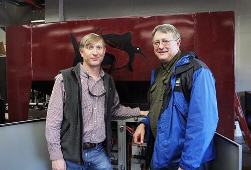 Wes Lowe, left, research associate in MSU’s Department of Agricultural and Biological Engineering, with MAFES Research Professor David Wise. Wise led the MSU team developing the oral vaccination platform. Lowe and Daniel Chesser, not pictured, designed the delivery system, which was instrumental in commercialising both technologies