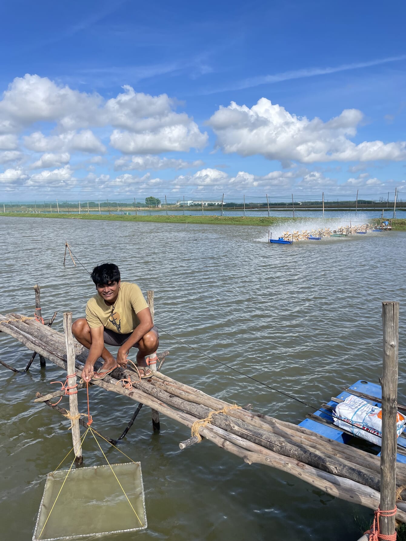 Bala Subramaniam next to his shrimp ponds.