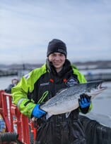 Cameron Tallach with one of the last batch of organic salmon to be harvested from Mowi's conventional net pen farm on Loch Ewe, which has now been disbanded