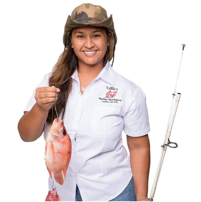 a woman hold a fish and a fishing rod