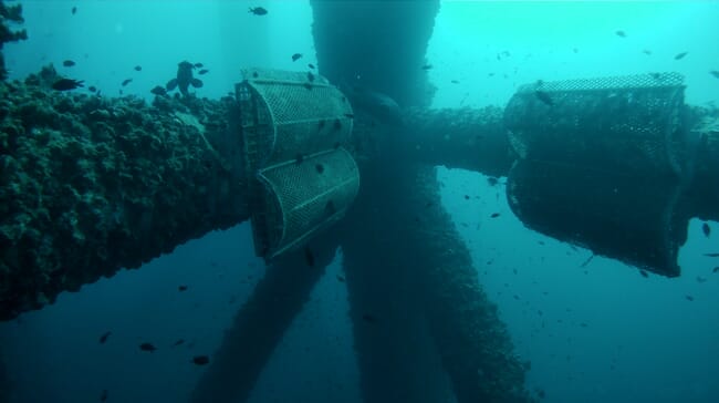 A underwater view of an oil rig