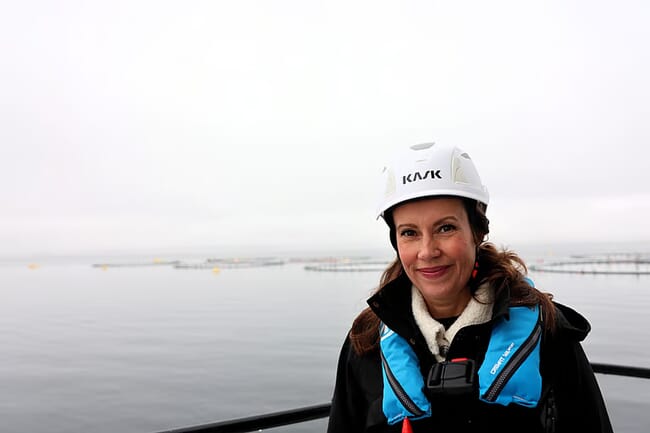 A photo of a minister of fisheries on the deck of a boat in Norway.