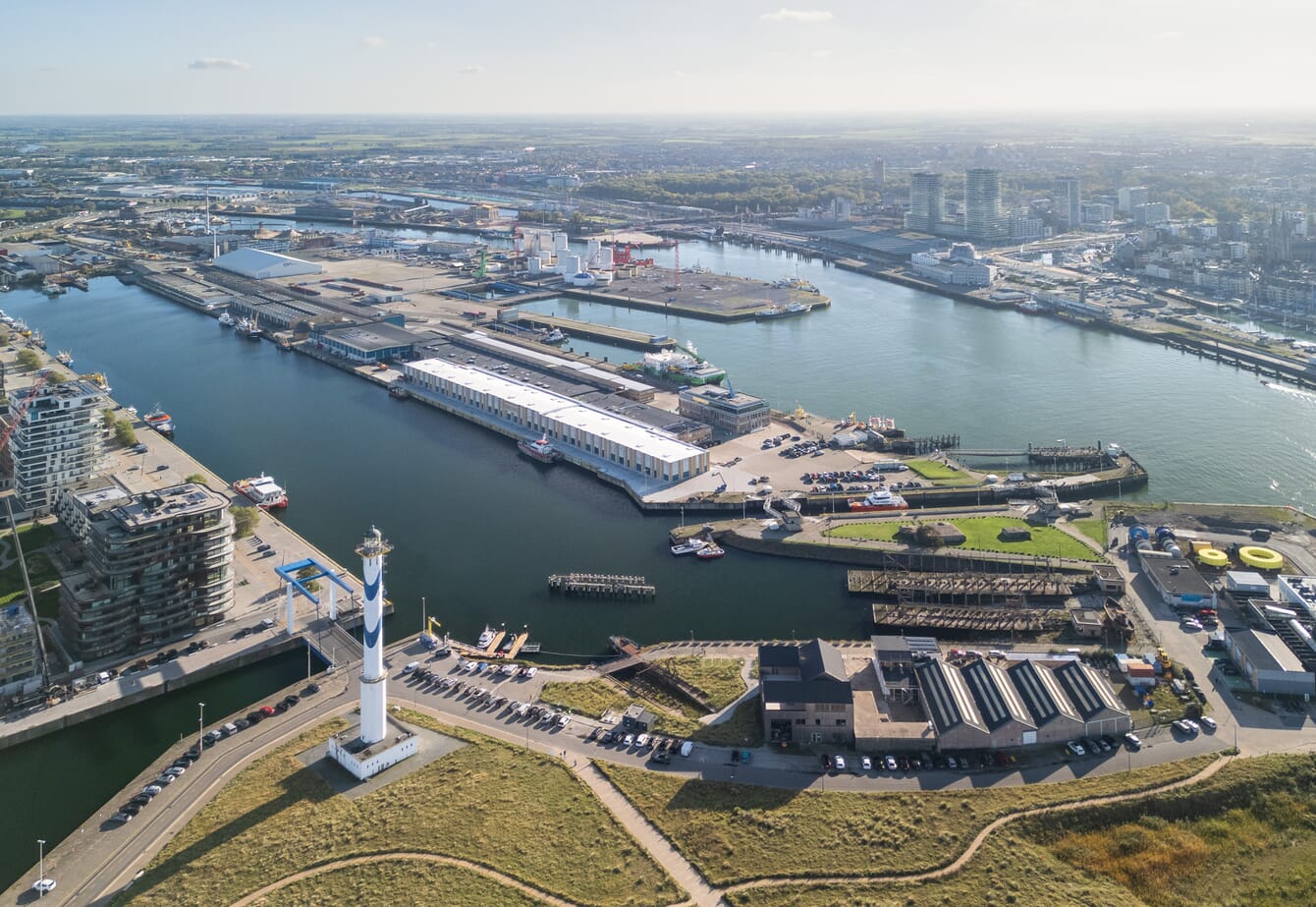 An aerial shot of a port in a city in Belgium.