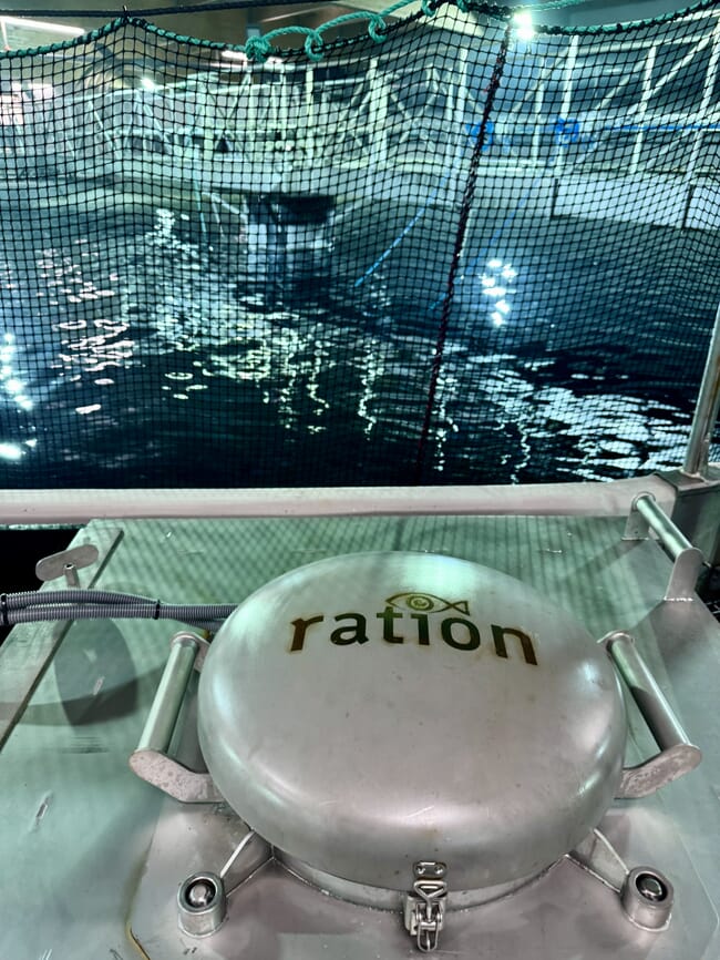A machine beside a large fish tank.