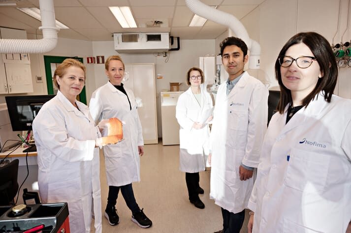 researchers standing in a lab