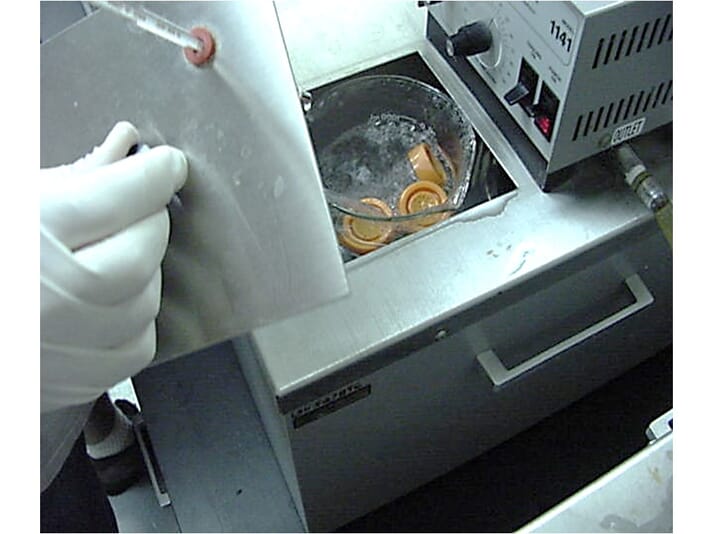 test tubes being dipped in freezing liquid