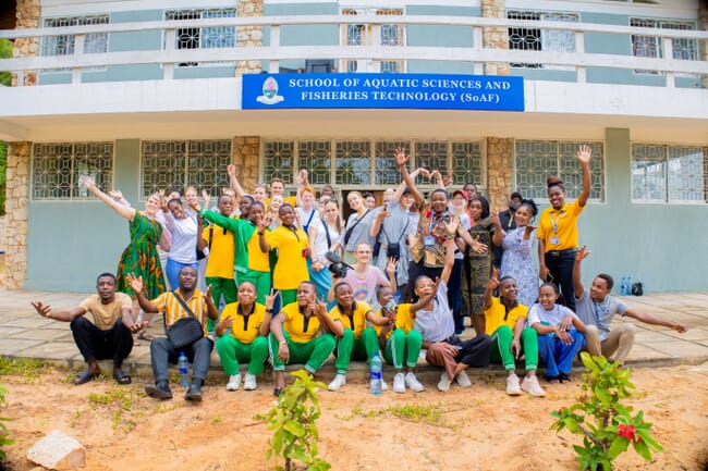 A group photo outside a building.