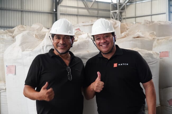 Two man giving thumbs up signals.