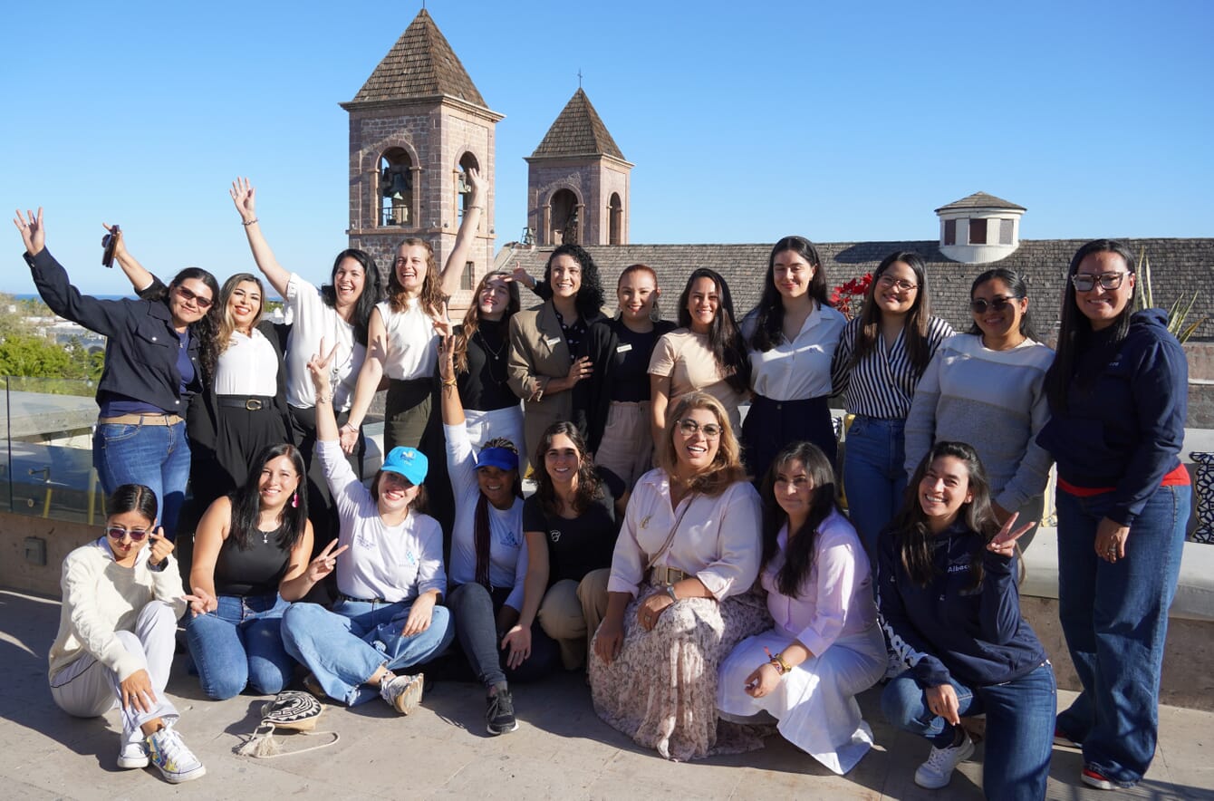 A group photo in front of a historic church.