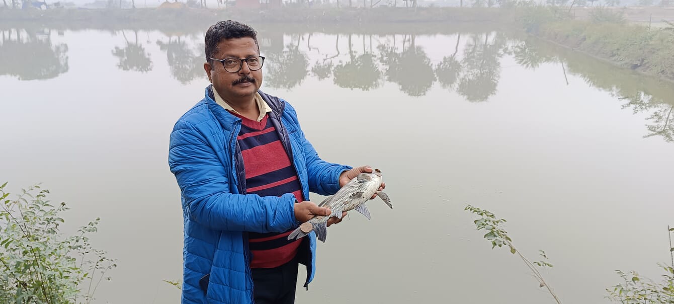A man holding a fish.
