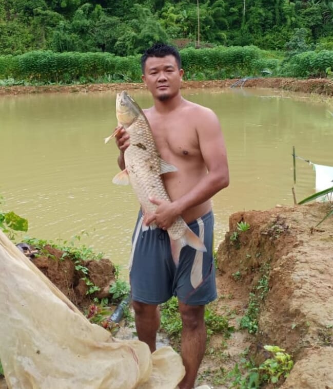 man holding a large carp