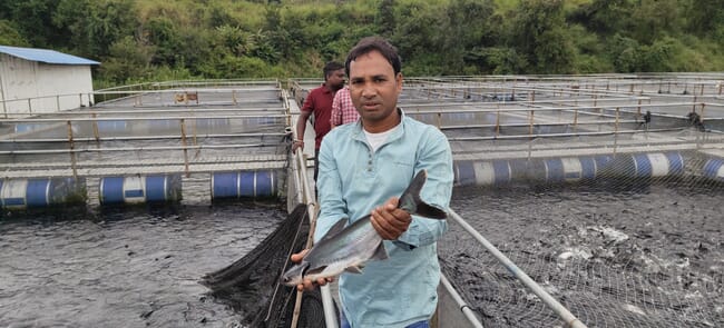 A man holding a fish.