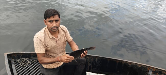 A man holding a fish.