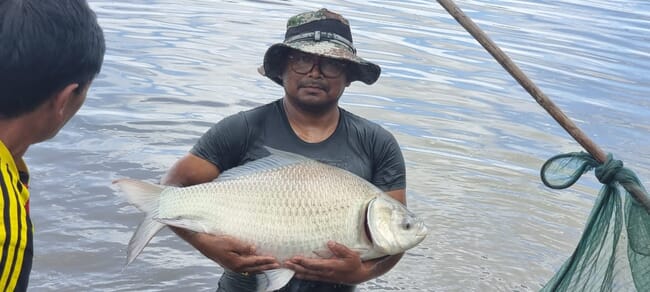 person holding a large fish