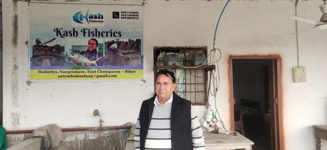 Man standing in front of a sign