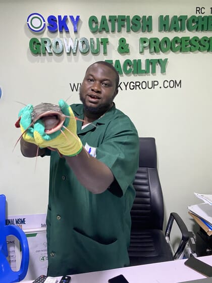 Man holding a catfish