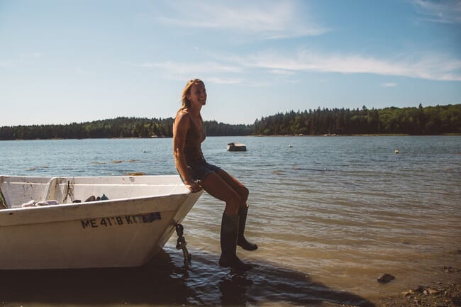 Abigail Barrows sitting on a boat