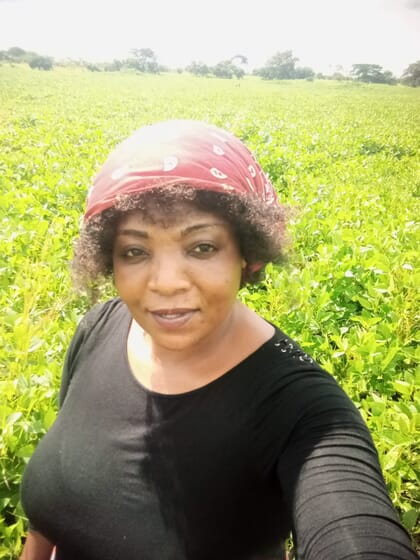 Headshot of woman in soy bean field