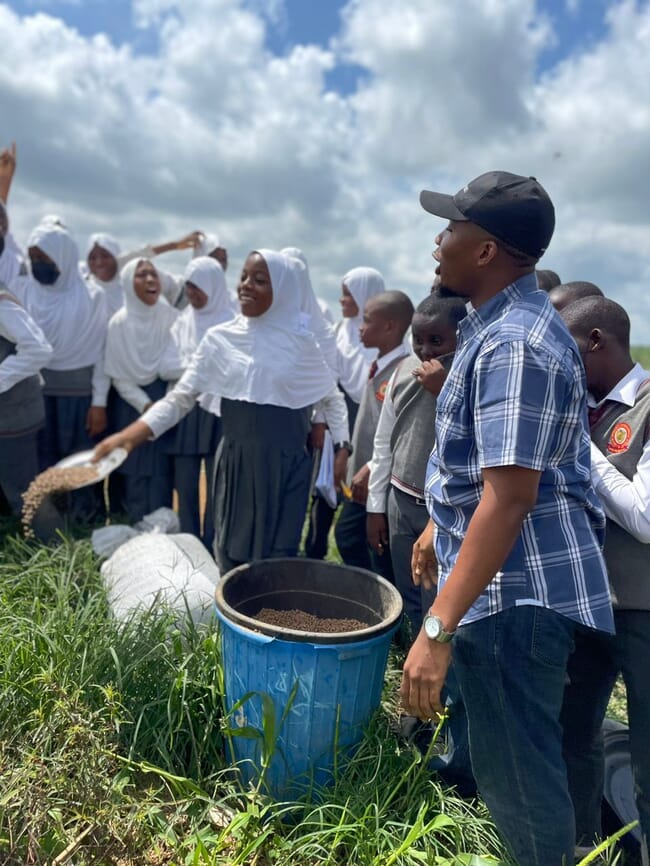 A person giving an aquaculture demonstration