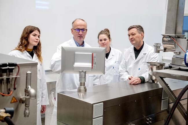 Nofima researchers at an aquafeed extruder.