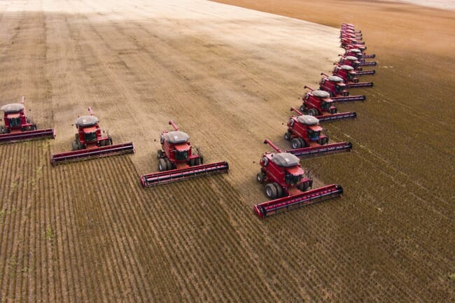 tractors harvesting soybeans