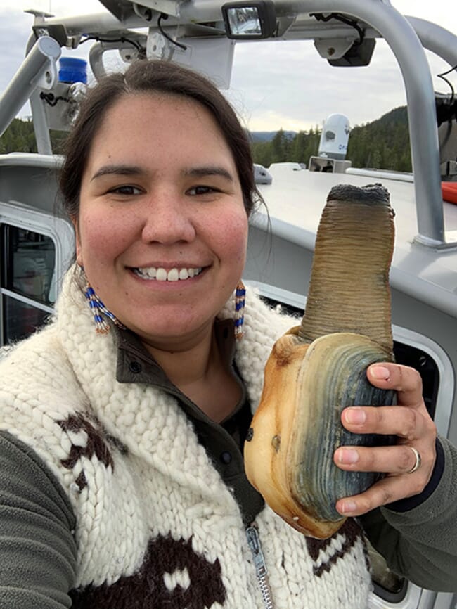 woman holding geoduck