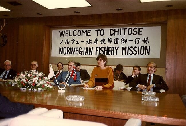 An official delegation sitting at a table.