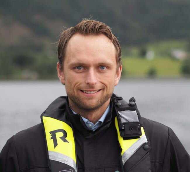 A headshot of a cod farmer out on the field.