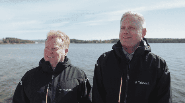 Two men in matching jackets.