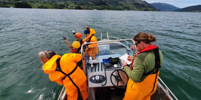 people in a research boat