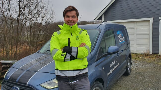 Portrait of young man wearing a hi viz jacket