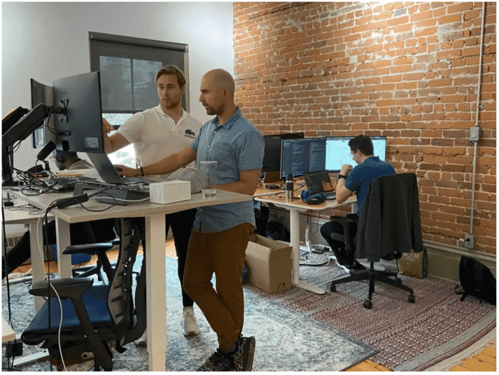 People working at a standing desk