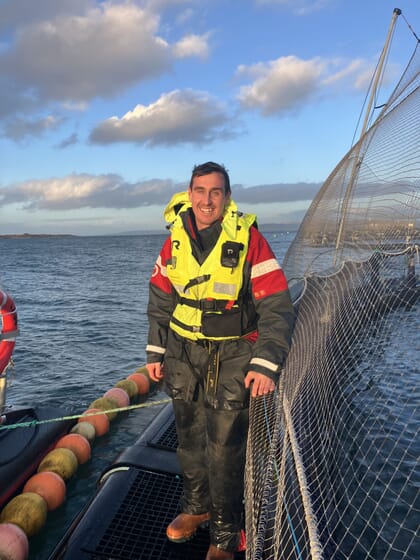 Craig Johnstone at a fish pen