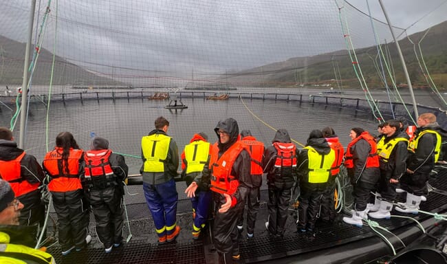 Students at a fish farm.