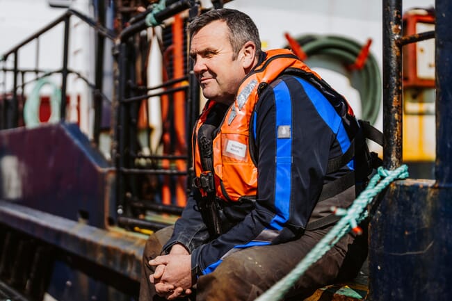 Stephen Woods on a feed barge