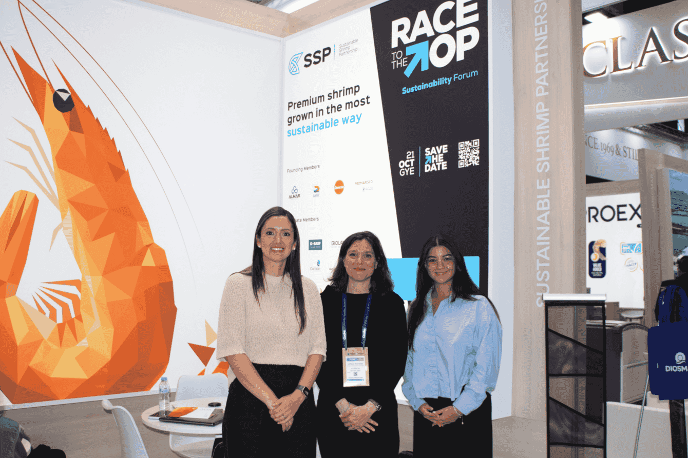 Three people at a trade stand.
