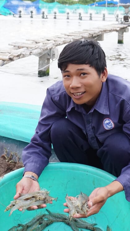 man holding shrimp