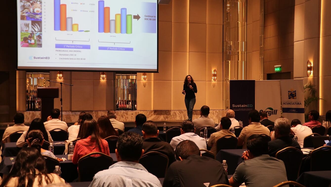 A women giving a shrimp health presentation in Ecuador.