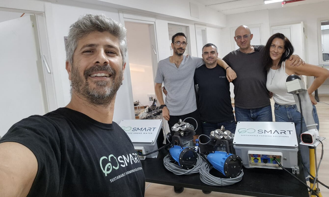 A group photo of the GoSmart team in their offices.